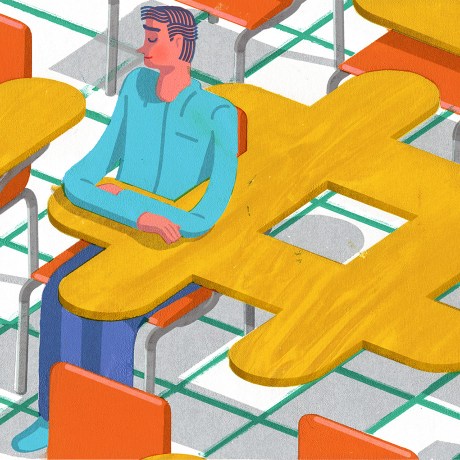 Student sitting in a desk in a classroom