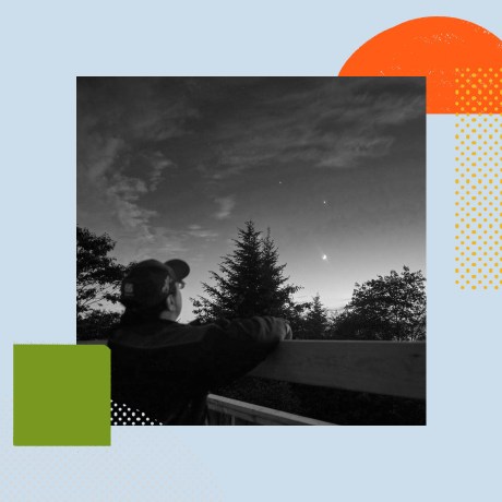 Tim Doucette peering out into the night sky