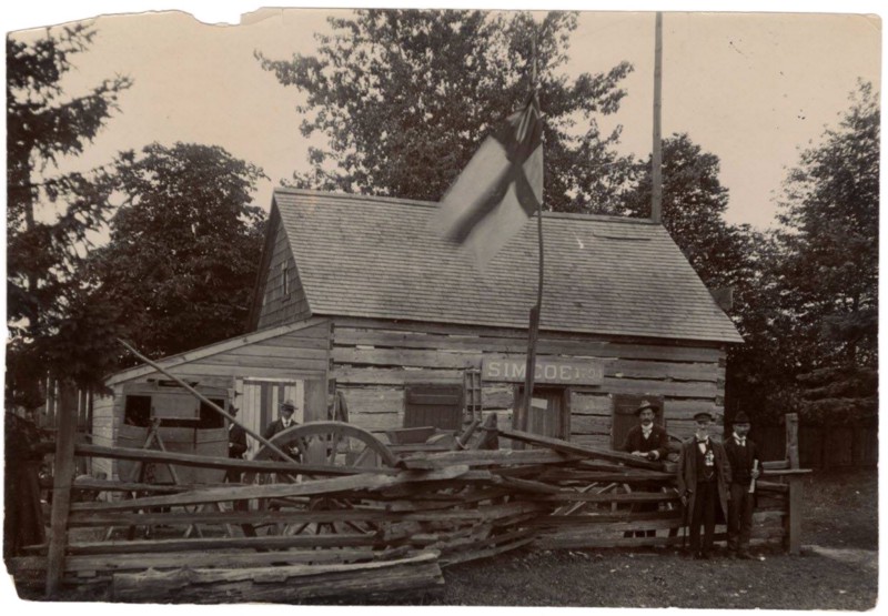 old cab in front of cabin