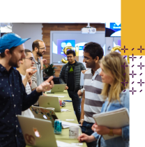 Participants showcase their Slack apps to judges in a science fair-style format.