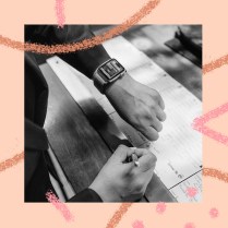 A SingleThread restaurant employee checks her Slack messages on a smartwatch.