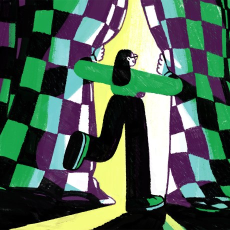 A person parts the curtains to enter the spotlight.