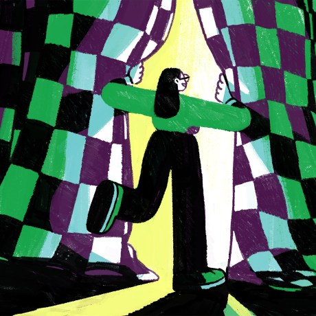 A person parts the curtains to enter the spotlight.