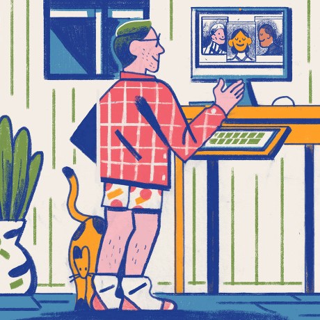 A man working remotely from his home office video conferences with coworkers