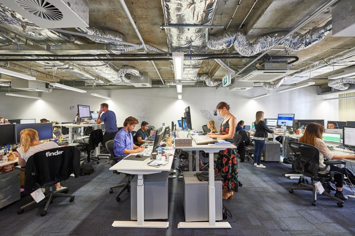 Finder employees working in an office before going remote